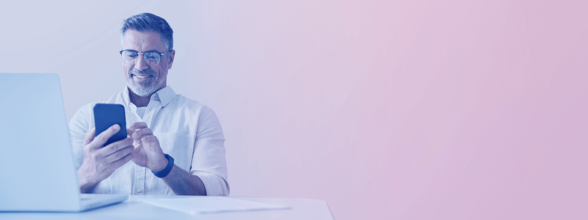 man smiling holding phone