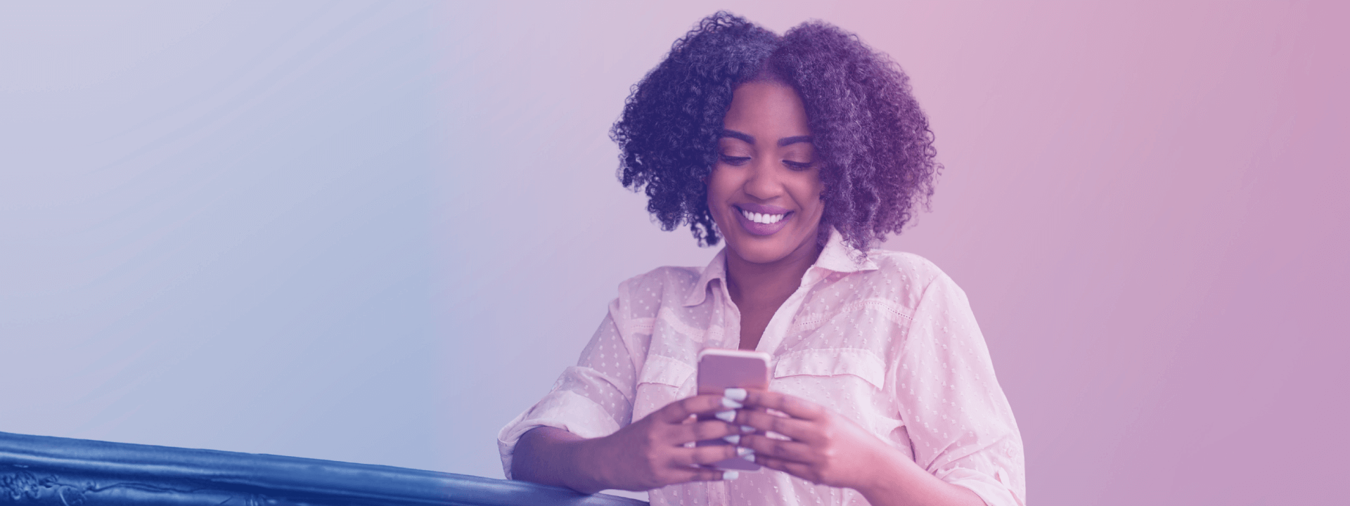 woman-smiling-looking-at-phone